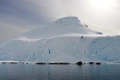 16B Steep Glacier Clad Southern Cuverville Island From Zodiac On Quark Expeditions Antarctica Cruise.jpg